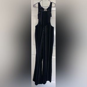 UO stripped bell bottom overalls